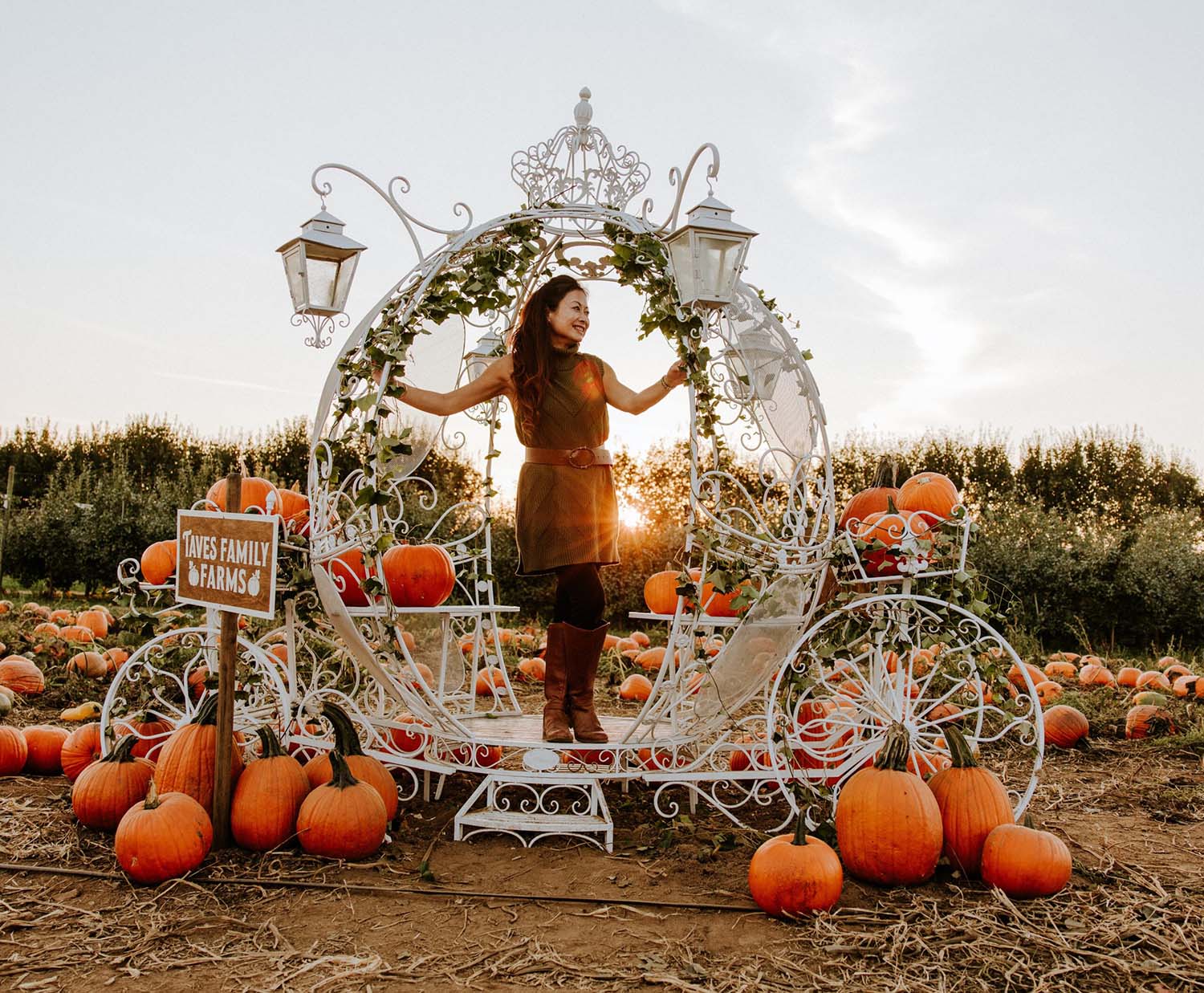 A women enjoying the magical pumpkin carriage in the u-pick pumpkin patch visited by people from Vancouver through Abbotsford
